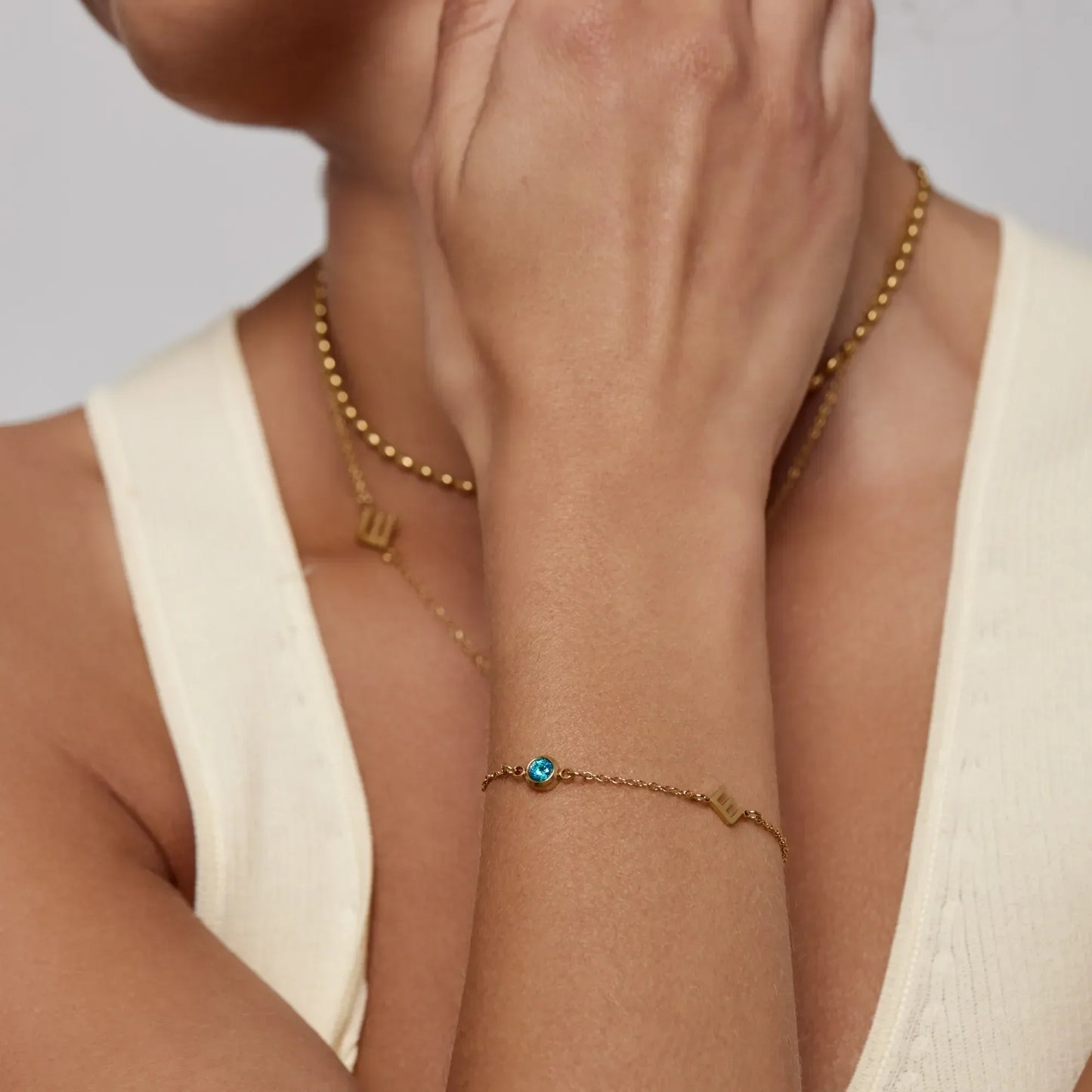 Initial birthstone bracelet lifestyle shot — Olivia Jewelry