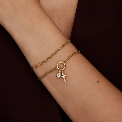 Gold paperclip cross charm bracelet close-up — Olivia Jewelry